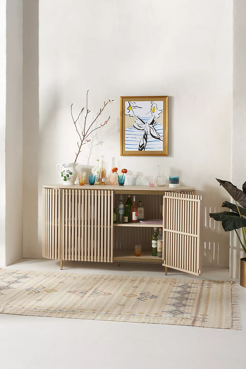 A wooden sideboard. A wooden console table.