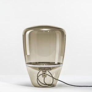 A hand-blown glass table lamp.