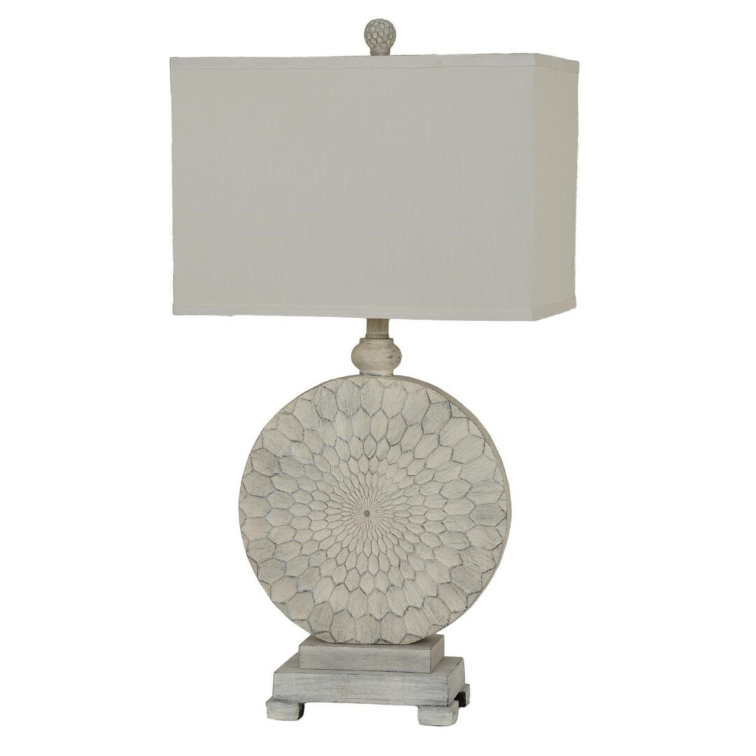 A white antique style table lamp.