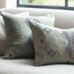 grey pillows on a grey sofa