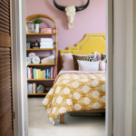 Affordable guest bedroom with statement lamp and rug