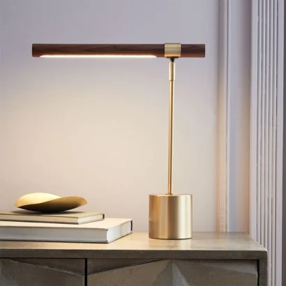 A gold and wood table lamp.