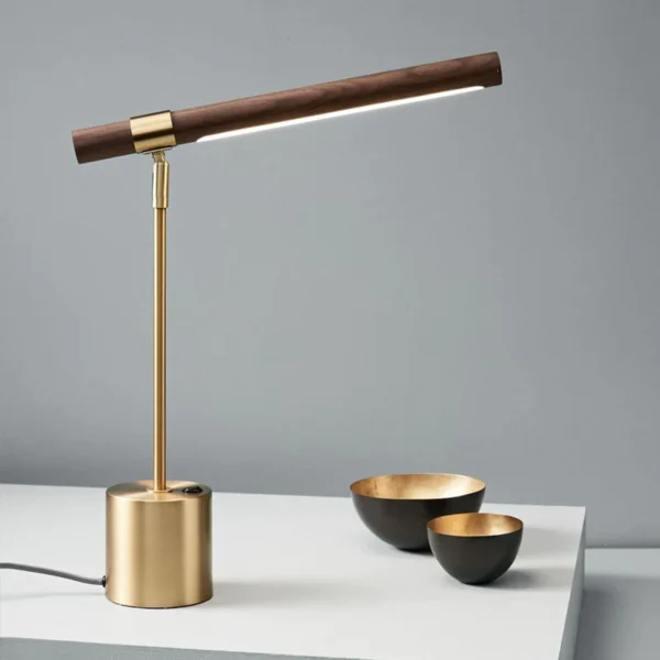 A gold and wood table lamp.