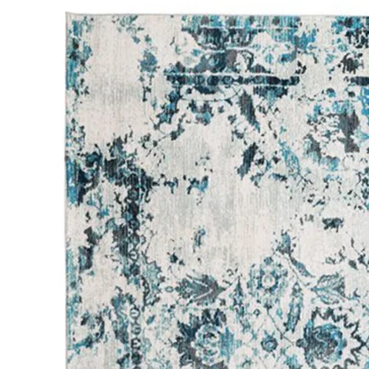 A white and blue antique pattern rug.