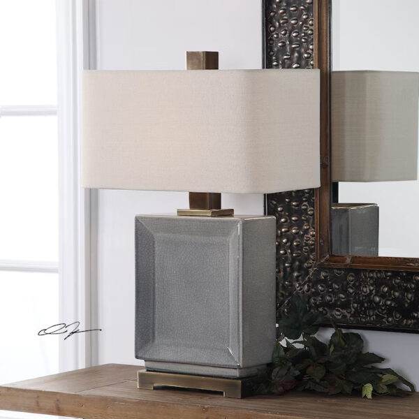 A grey ceramic rectangular table lamp.