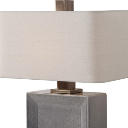 A grey ceramic rectangular table lamp.