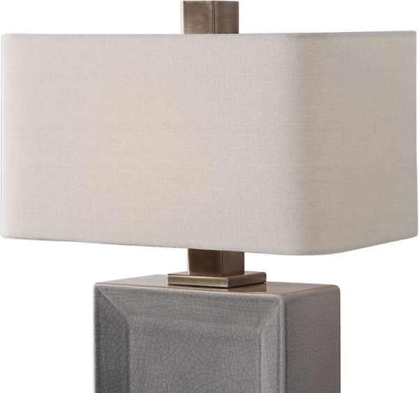 A grey ceramic rectangular table lamp.