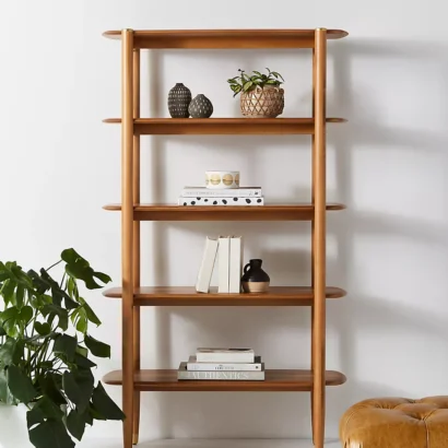 A wooden shelf. A wooden bookshelf. A wooden shelving unit.