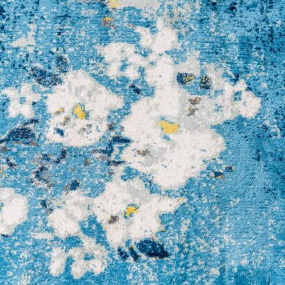 A blue rug with white flowers.