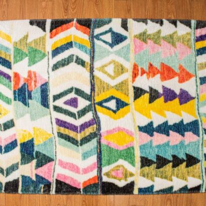 A multi-colored, eclectic patterned rug.