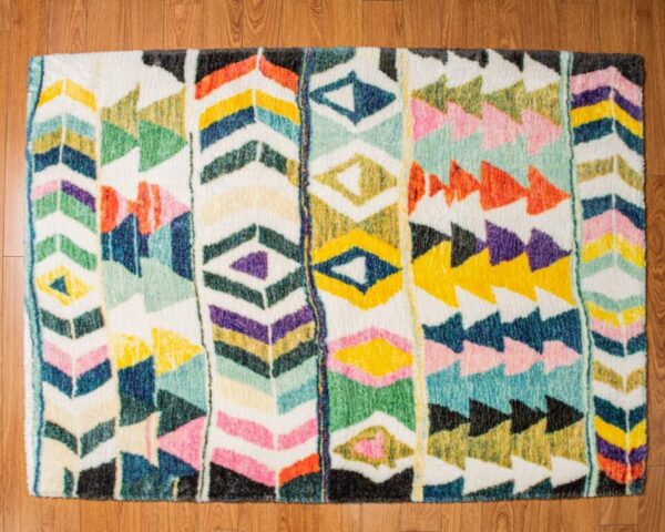 A multi-colored, eclectic patterned rug.