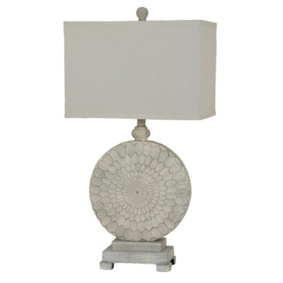 A white antique style table lamp.