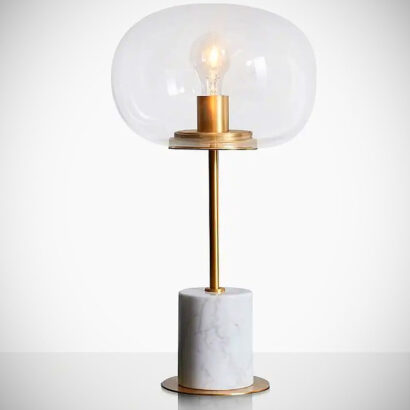 A white marble and gold table lamp.