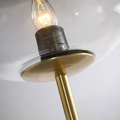 A gold lamp and glass bulb.