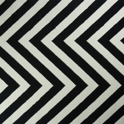 A white and black zigzag rug.