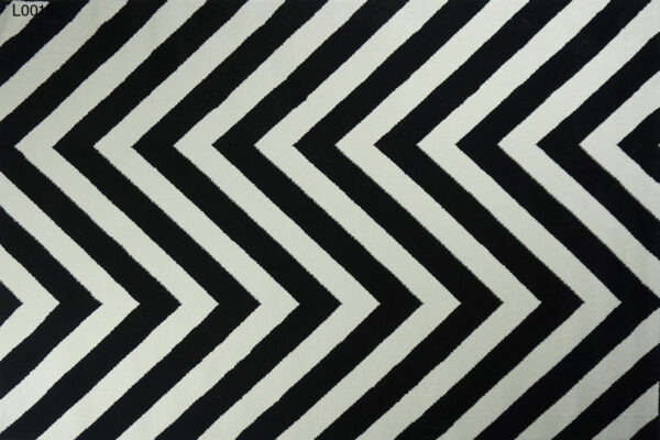 A white and black zigzag rug.