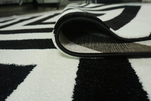 A white and black zigzag rug.