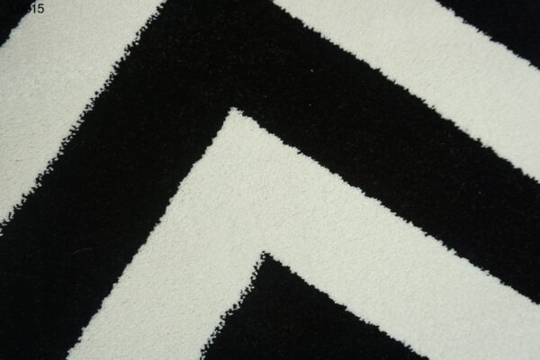 A white and black zigzag rug.