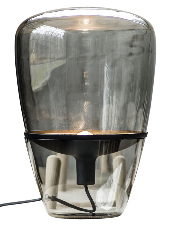 A glass balloon shaped table lamp.