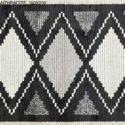 A black and white rug with diamond patterns.