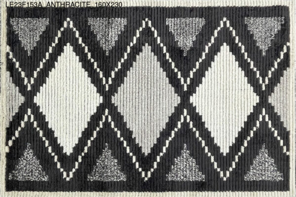 A black and white rug with diamond patterns.