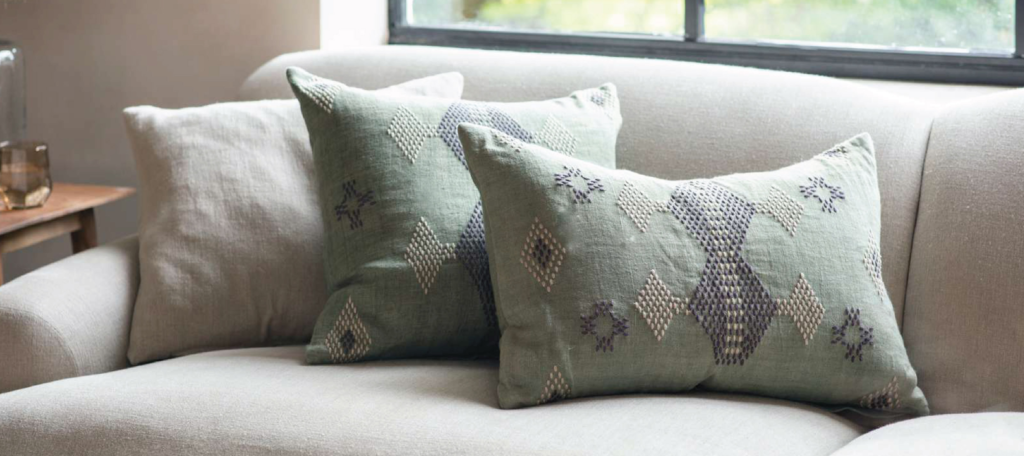 grey pillows on a grey sofa