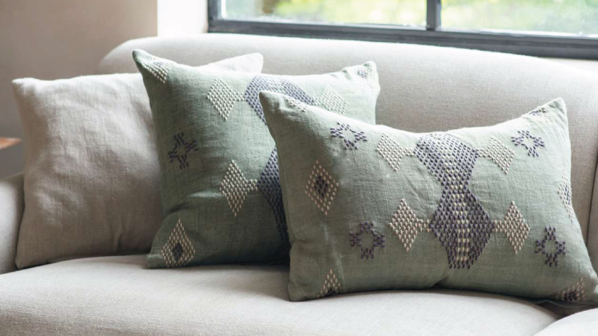 grey pillows on a grey sofa